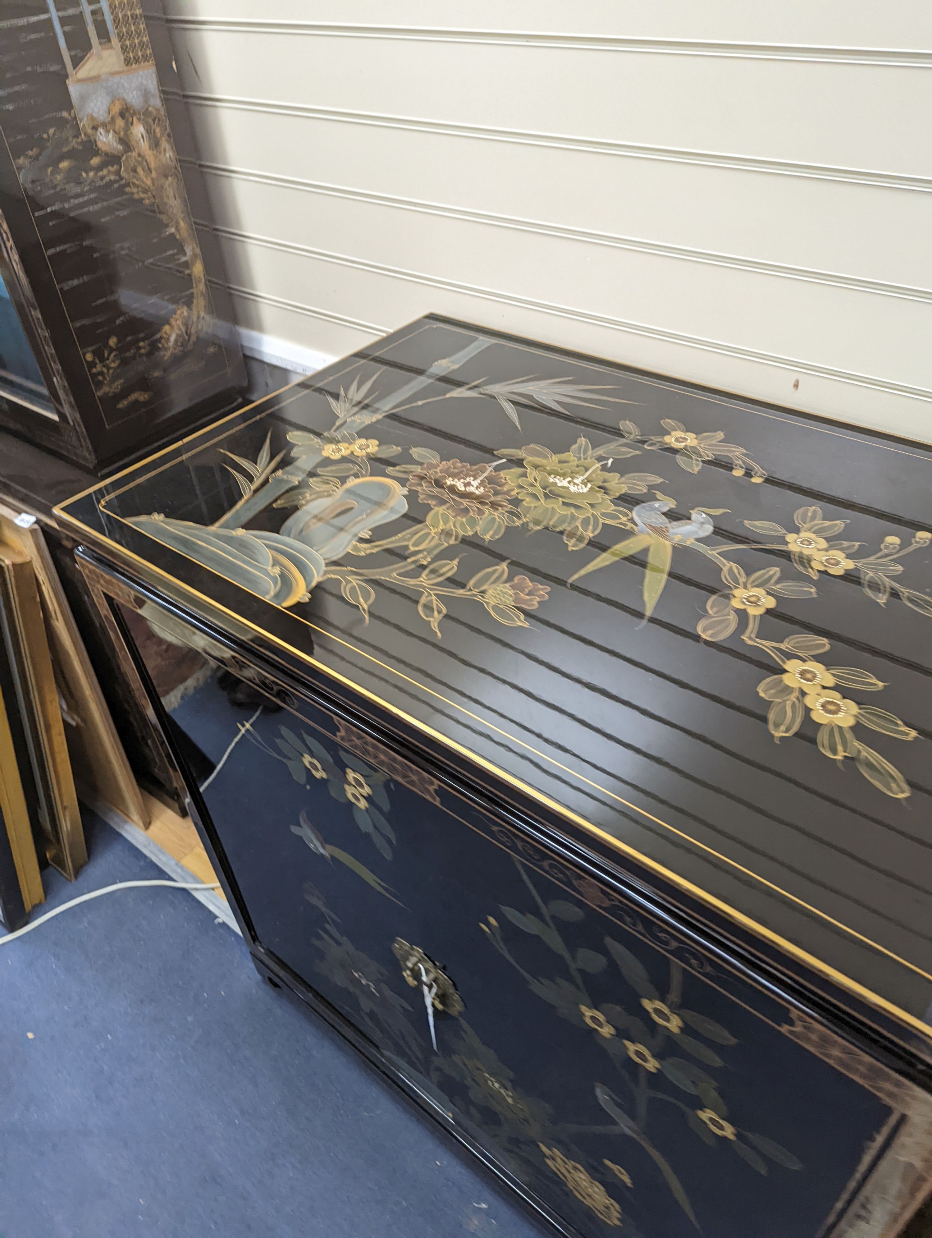 A Chinese lacquer media cabinet. W-94cm, D-61cm, H-102cm.